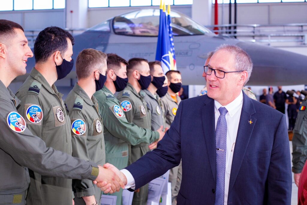 Lockheed Martin Chief Operating Officer Frank St. John congratulates the first mission-ready F-16 pilots to graduate from the European F-16 Training Center (Lockheed Martin)