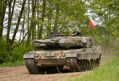 A Polish army Leopard tank returns to the tactical assembly area to prepare for a Defender Europe multinational situational exercise at Drawsko Pomorskie, Poland, May 25, 2022. Defender Europe 22 is a series of U.S. Army Europe and Africa multinational training exercises taking place in Eastern Europe. The exercise demonstrates U.S. Army Europe and Africa’s ability to conduct large-scale ground combat operations across multiple theaters in support of NATO. (U.S. Army photo by Capt. Tobias Cukale)