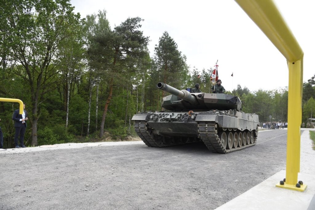 A Polish Army Leopard 2 tank is the first to cross the newly completed bridge over the River Kwisa at the Żagan Świętoszów Training Area in Poland during a ceremony there May 24, 2022. The bridge project is one of many training range improvements the U.S. Army Corps of Engineers has delivered in Poland in partnership with the Polish Army, the U.S. Army’s 7th Army Training Command and others. These projects improve readiness and interoperability of U.S., host nation and allied forces. (U.S. Army photo by Alfredo Barraza).