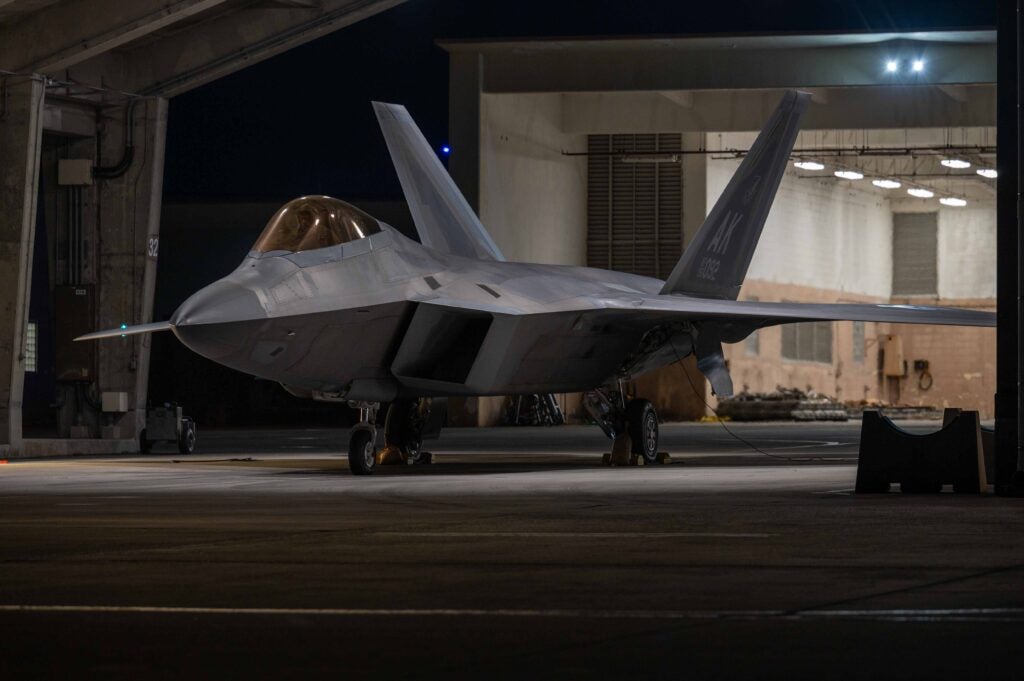 A U.S. Air Force F-22A Raptor assigned to the 525th Expeditionary Fighter Squadron sits parked in a flow-through during a base-wide readiness exercise at Kadena Air Base, Japan, Jan. 15, 2025. The diverse array of fighters, alongside joint and allied forces strengthen operational readiness to defend Japan while ensuring a free and open Indo-Pacific through a robust presence of dynamic fighter aircraft. (U.S. Air Force photo by Airman 1st Class Catherine Daniel)